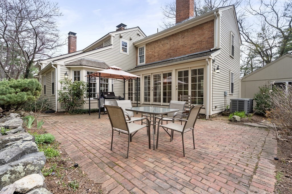 92 Goodnow Road Sudbury, MA 01776 - Photo 29 of 37 a view of a house with backyard and sitting area