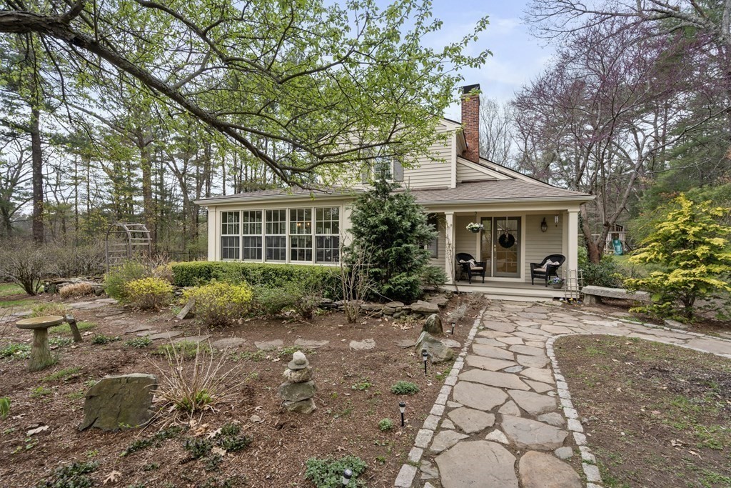 92 Goodnow Road Sudbury, MA 01776 - Photo 31 of 37 a front view of a house with a garden