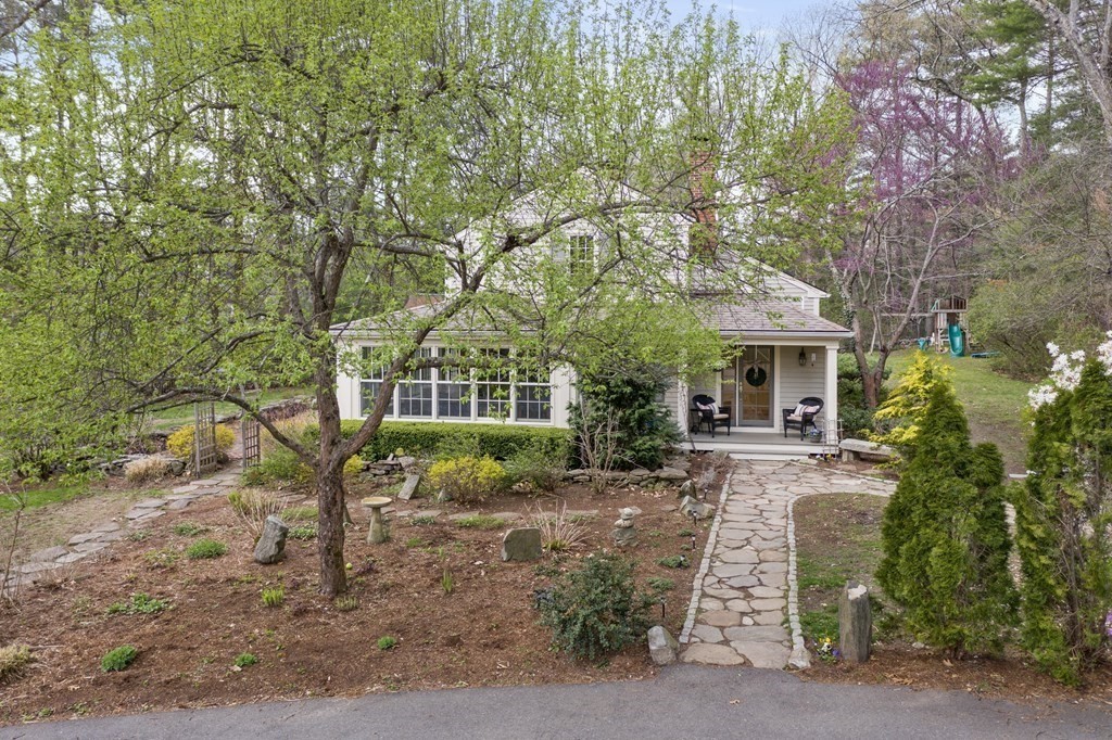 92 Goodnow Road Sudbury, MA 01776 - Photo 32 of 37 a view of a house with a tree in the yard