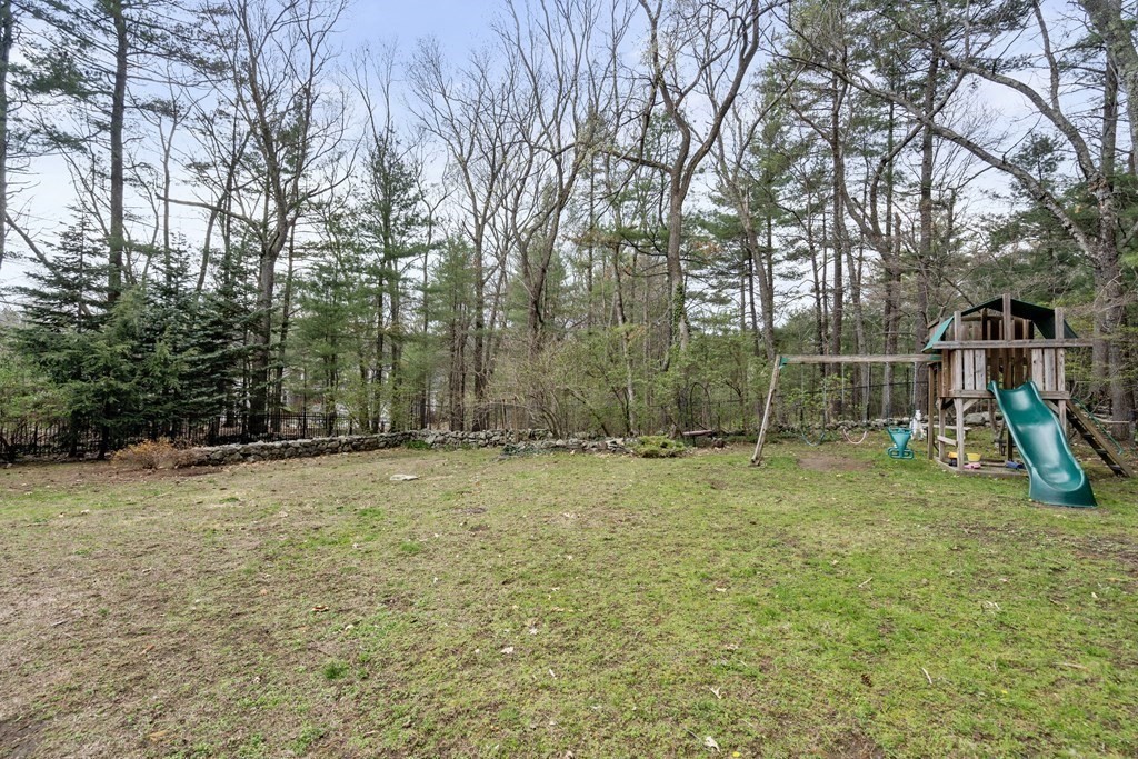92 Goodnow Road Sudbury, MA 01776 - Photo 34 of 37 a view of outdoor space with deck and trees