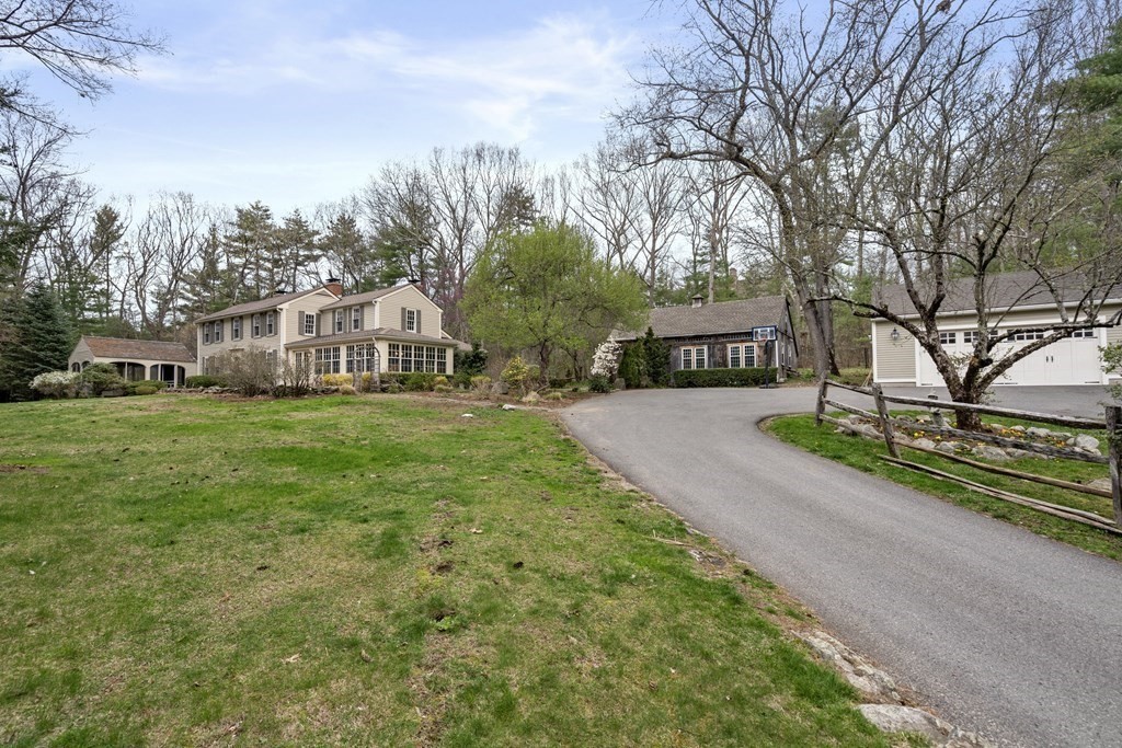 92 Goodnow Road Sudbury, MA 01776 - Photo 35 of 37 a view of a house with a big yard and large trees