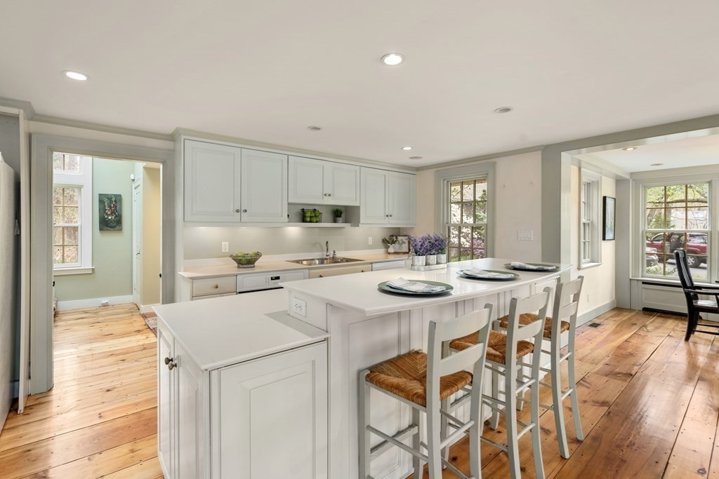 92 Goodnow Road Sudbury, MA 01776 - Photo 5 of 37 a open kitchen with stainless steel appliances kitchen island granite countertop a sink and cabinets