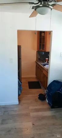 a room with wooden floor and furniture