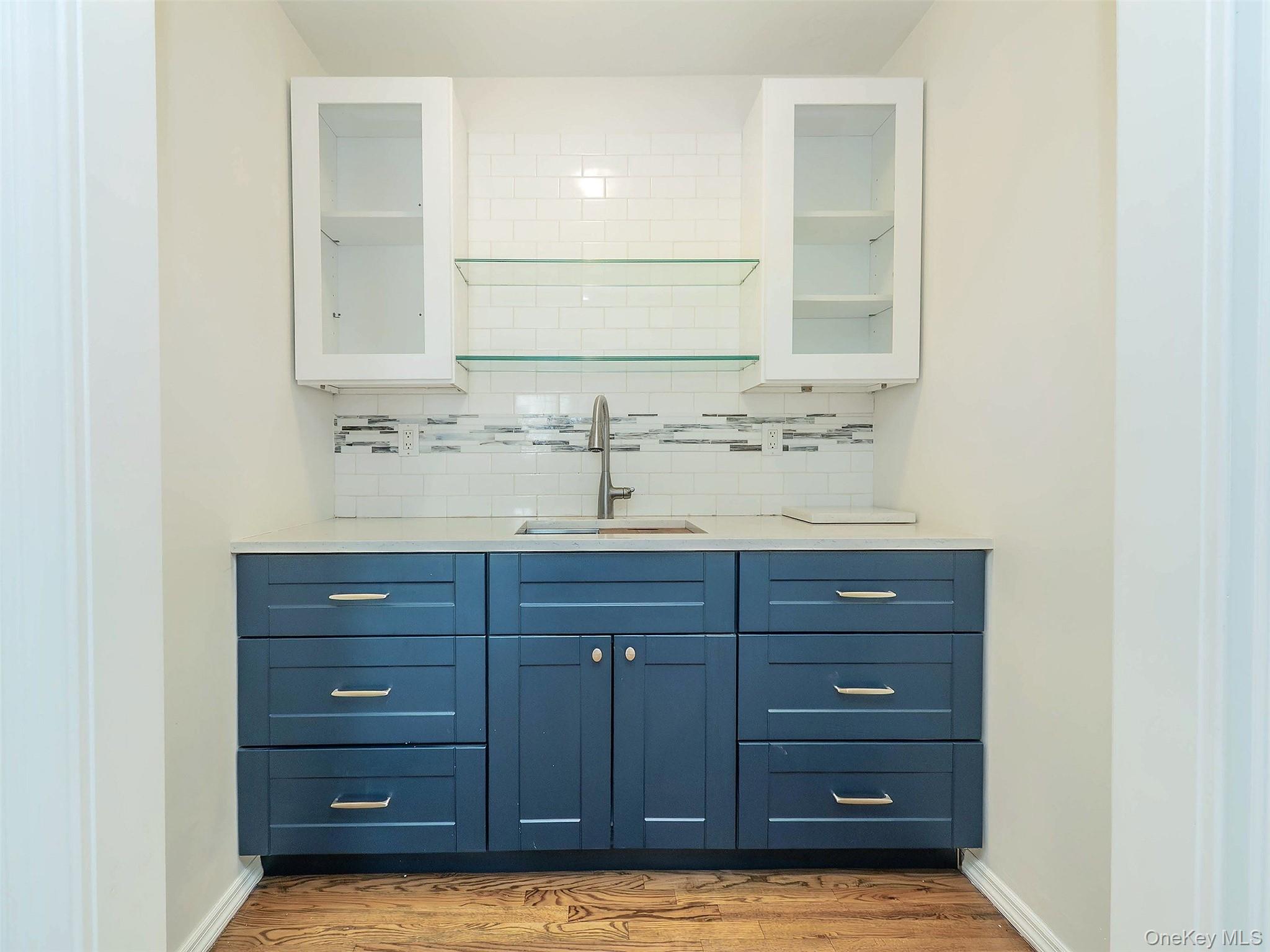 21 Marwood Road North Port Washington, NY 11050 - Photo 12 of 35 a bathroom with a granite countertop double vanity sink and mirror