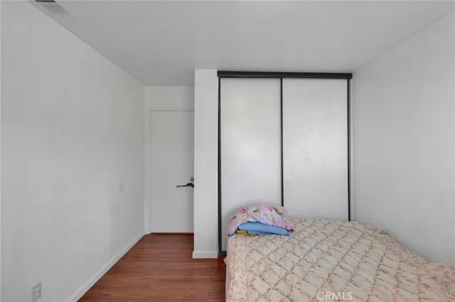 a bedroom with a bed and a hallway