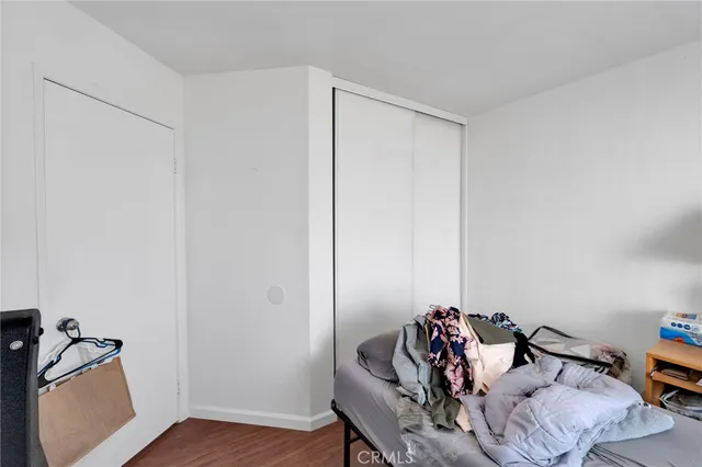 a view of a workspace with furniture and wooden floor