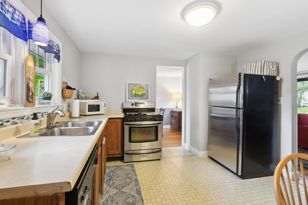 8 Dodge Street Arlington, MA 02474 - Photo 12 of 36 a kitchen with a refrigerator stove and sink