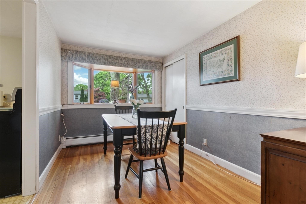 8 Dodge Street Arlington, MA 02474 - Photo 16 of 36 a view of a dining room with furniture window and wooden floor