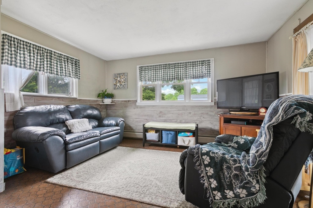 8 Dodge Street Arlington, MA 02474 - Photo 17 of 36 a living room with furniture and a fireplace