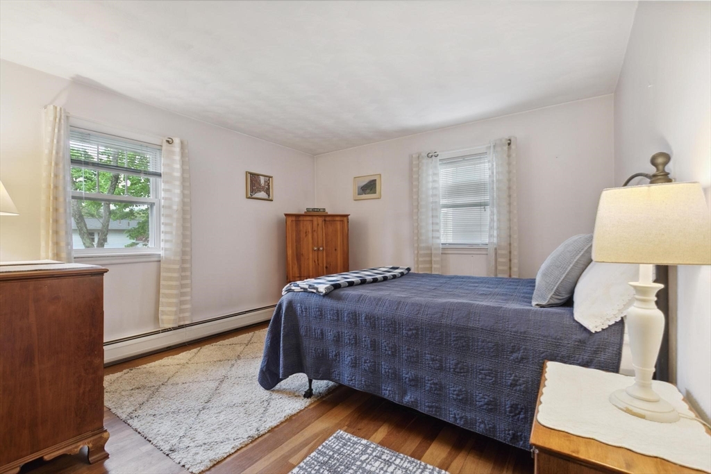 8 Dodge Street Arlington, MA 02474 - Photo 18 of 36 a bedroom with a bed and window