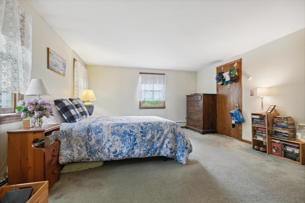 8 Dodge Street Arlington, MA 02474 - Photo 23 of 36 a bedroom with bed and window