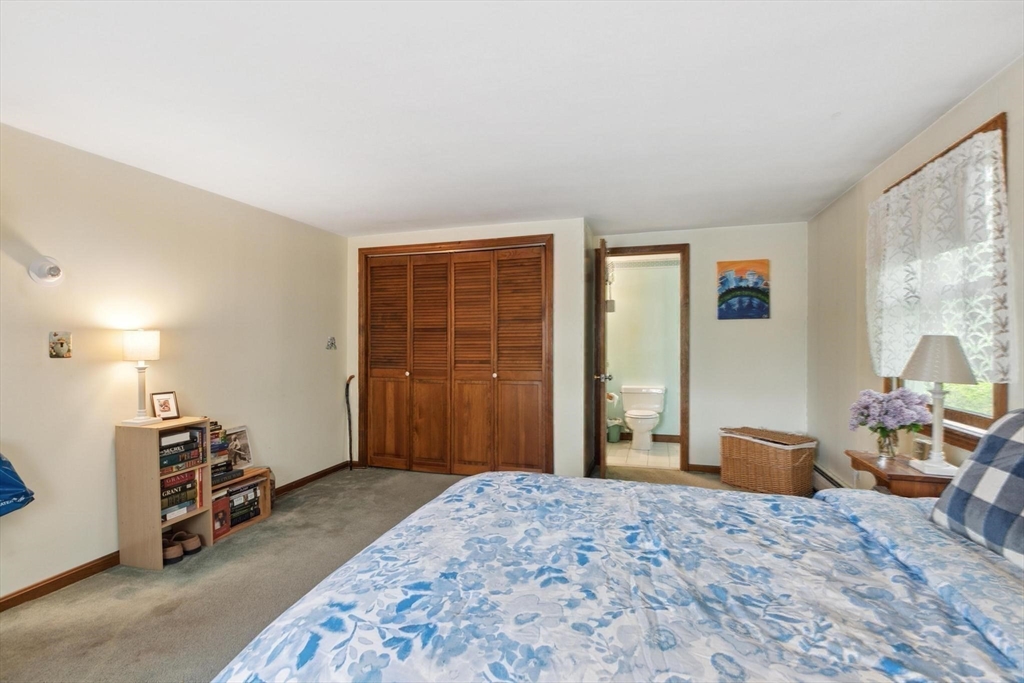8 Dodge Street Arlington, MA 02474 - Photo 24 of 36 a bedroom with furniture and a window