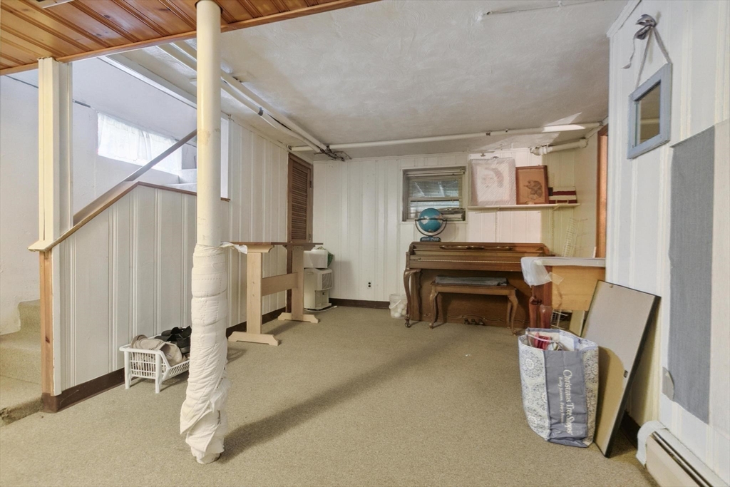 8 Dodge Street Arlington, MA 02474 - Photo 26 of 36 a bedroom with furniture and a window