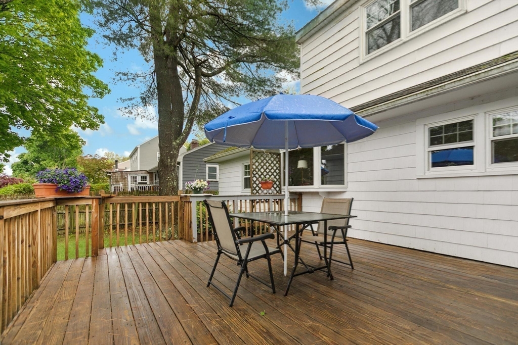 8 Dodge Street Arlington, MA 02474 - Photo 30 of 36 a view of house with wooden deck and outdoor seating