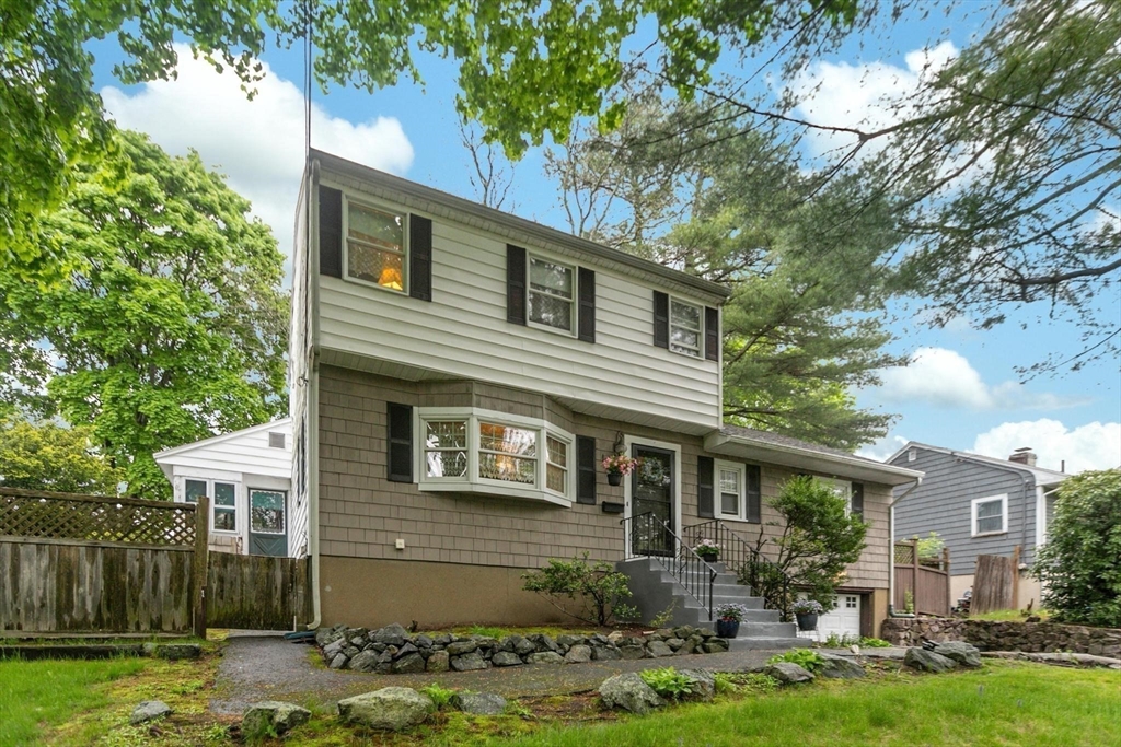 8 Dodge Street Arlington, MA 02474 - Photo 4 of 36 a front view of a house with garden