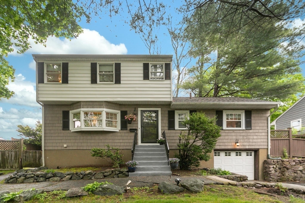 8 Dodge Street Arlington, MA 02474 - Photo 5 of 36 a front view of a house with garden