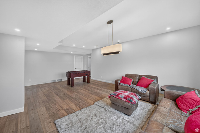767 Draper View Road Draper, UT 84020 - Photo 46 of 71 Spacious recreational area featuring wood-finish flooring, recessed lighting, and a contemporary chandelier