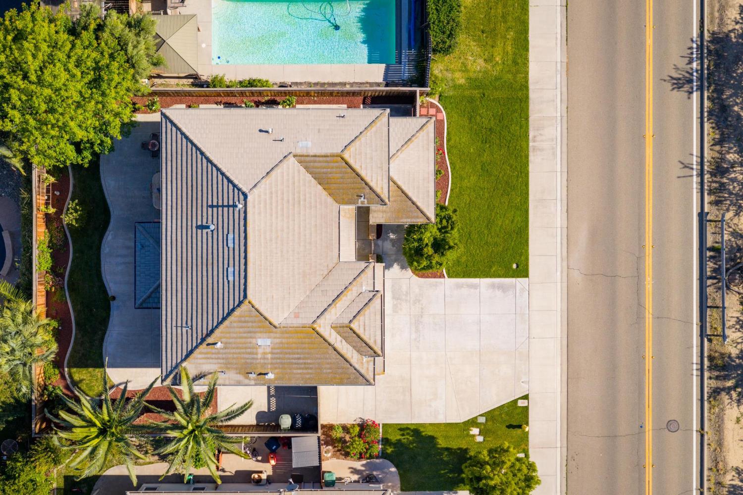 426 South Highland Avenue Ripon, CA 95366 - Photo 2 of 82 an aerial view of a house with swimming pool