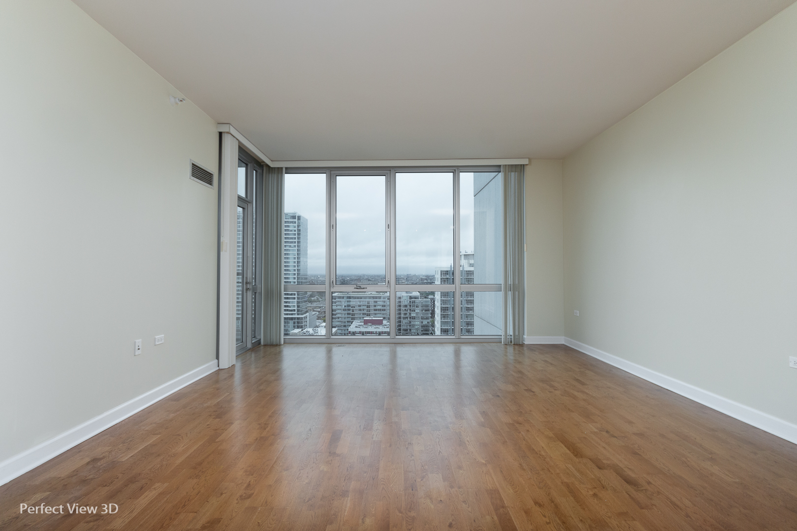 1629 South Prairie Avenue, Unit 2010 Chicago, IL 60616 - Photo 3 of 20 wooden floor in an empty room with a window