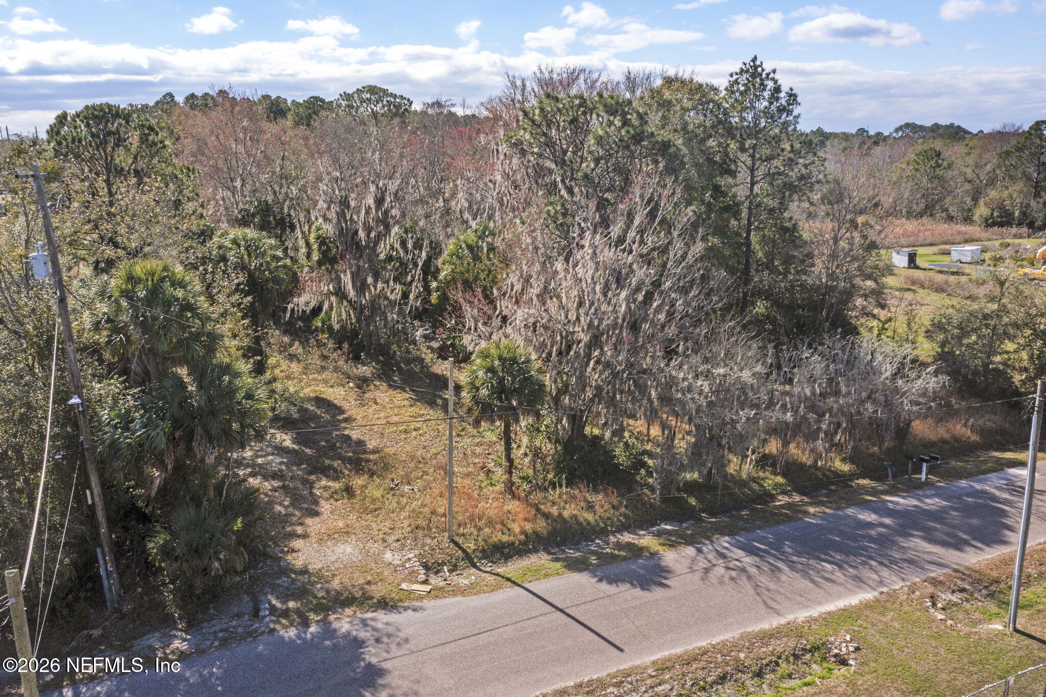 388 Bird Road Jacksonville, FL 32218 - Photo 3 of 9 a view of a yard with wooden fence
