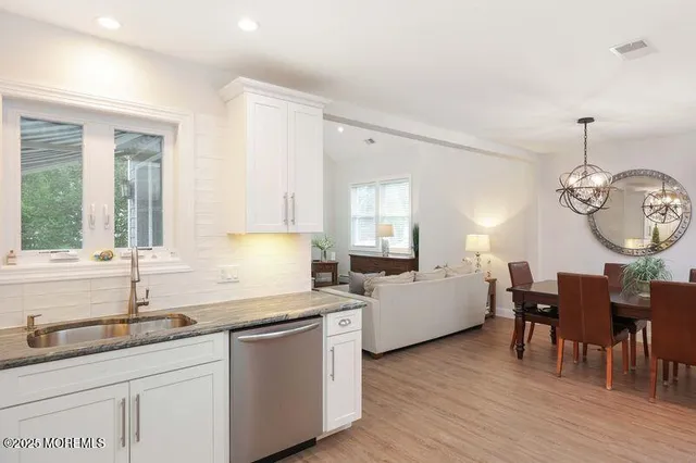 a kitchen with sink and cabinets