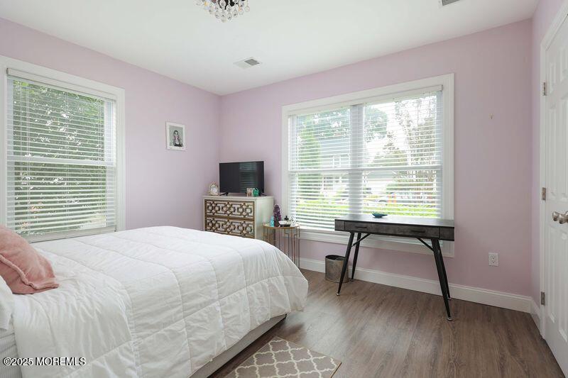 63 Carpenter Street Red Bank, NJ 07701 - Photo 15 of 35 a bedroom with a bed and a table in it