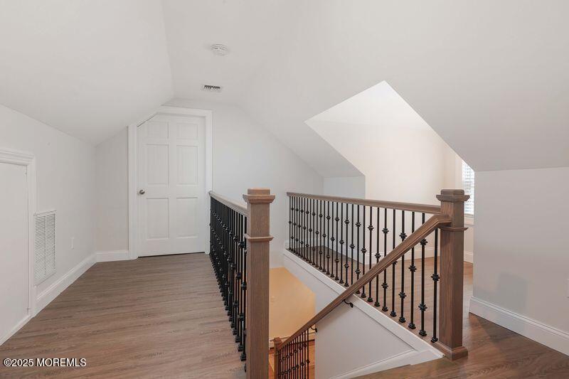 63 Carpenter Street Red Bank, NJ 07701 - Photo 18 of 35 a view of a hallway with wooden floor and entryway