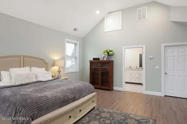 a bedroom with a bed and a closet