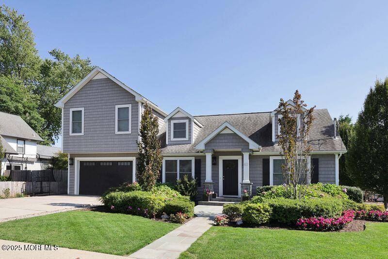 63 Carpenter Street Red Bank, NJ 07701 - Photo 28 of 35 a front view of a house with a garden and plants