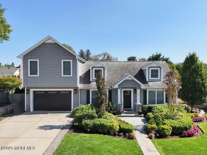 63 Carpenter Street Red Bank, NJ 07701 - Photo 4 of 35 a front view of a house with garden