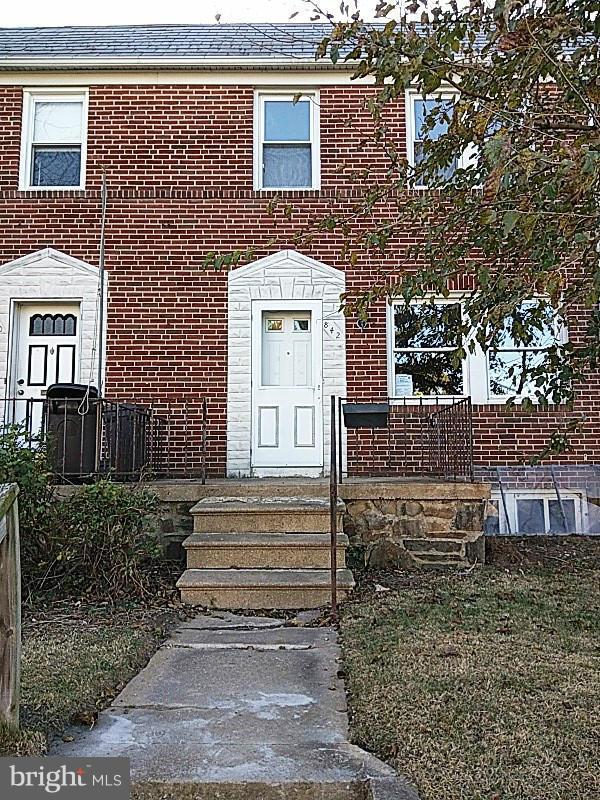 842 Braeside Road Baltimore, MD 21229 - Photo 1 of 26 a view of a brick house with many windows