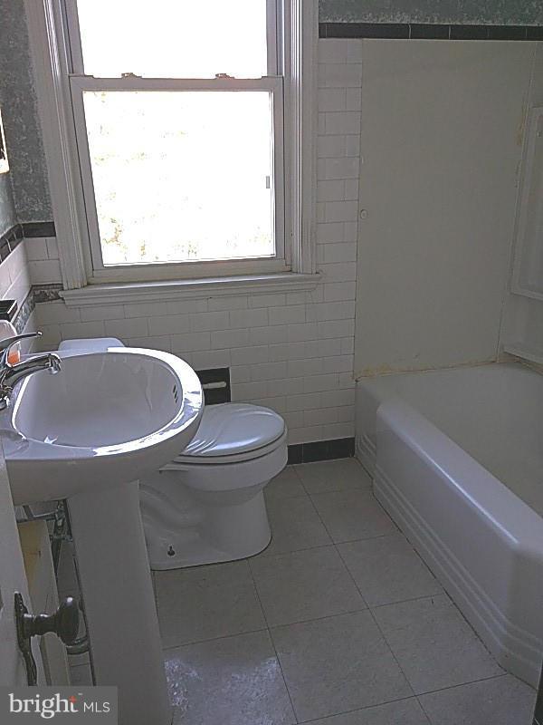 842 Braeside Road Baltimore, MD 21229 - Photo 17 of 26 a bathroom with a sink and a toilet