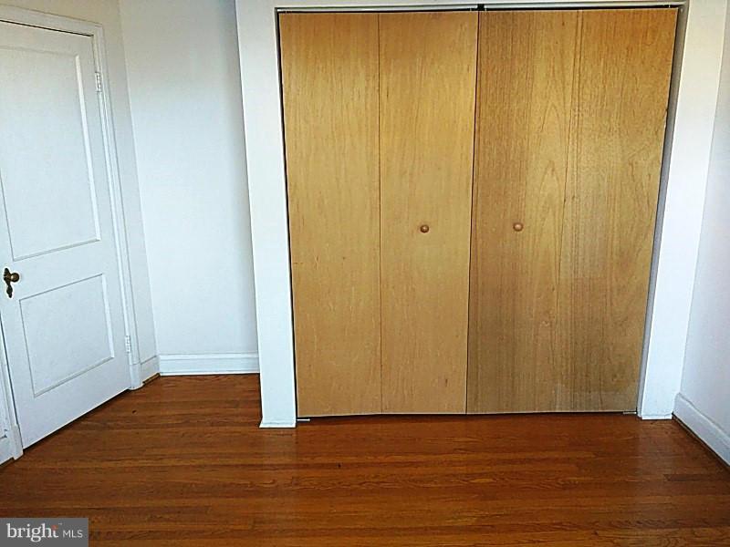 842 Braeside Road Baltimore, MD 21229 - Photo 18 of 26 a view of a small space with wooden floor