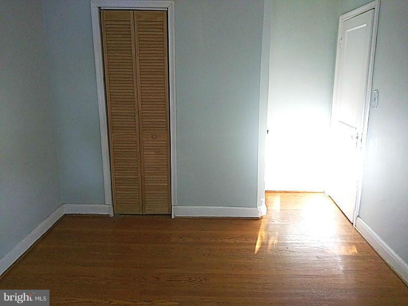 842 Braeside Road Baltimore, MD 21229 - Photo 22 of 26 a view of an empty room and window