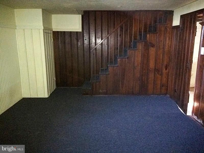 842 Braeside Road Baltimore, MD 21229 - Photo 24 of 26 an empty room with wooden walls
