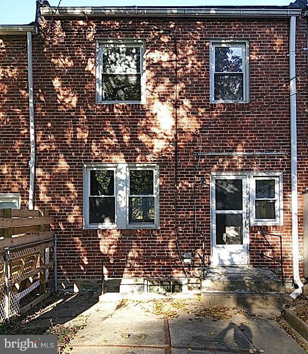 842 Braeside Road Baltimore, MD 21229 - Photo 4 of 26 a front view of a house with a yard