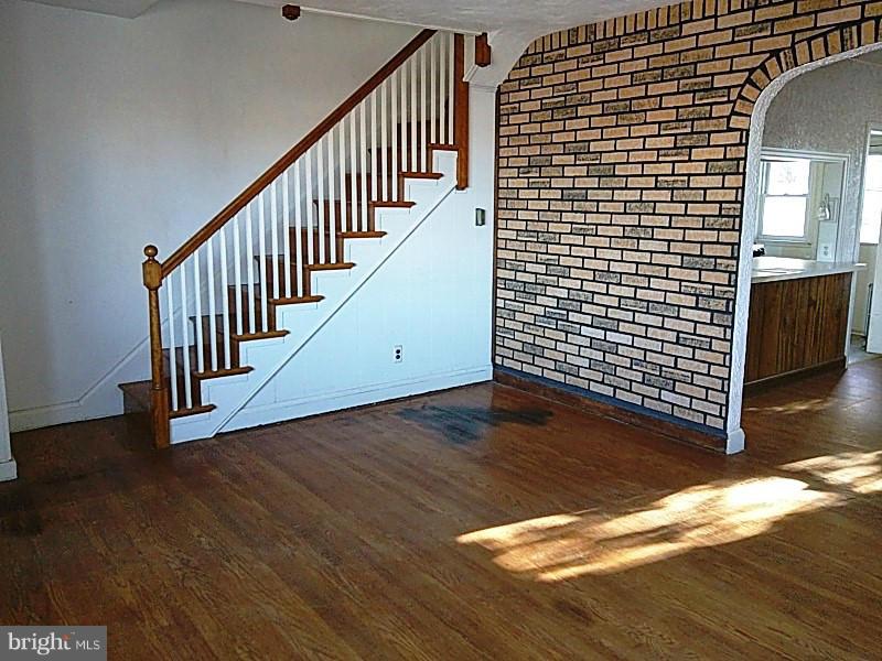 842 Braeside Road Baltimore, MD 21229 - Photo 9 of 26 a view of a livingroom with wooden floor