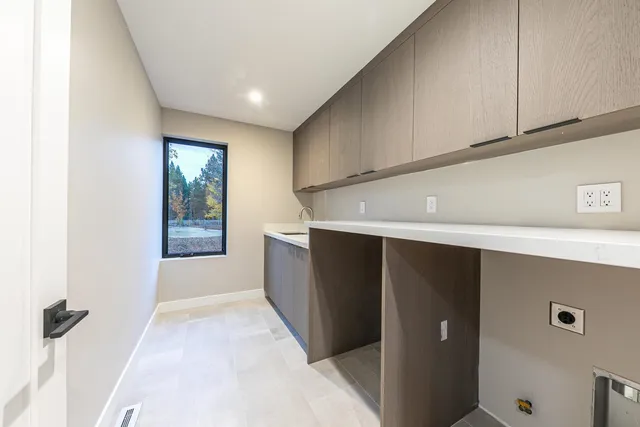 a view of hallway with window and stairs