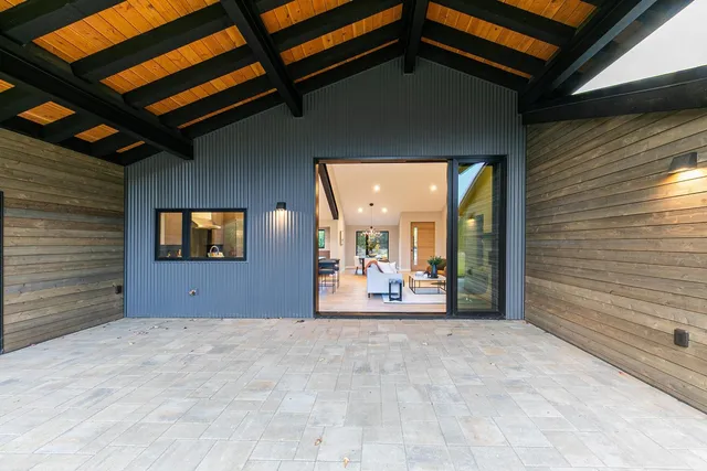a view of a hallway with wooden shelves