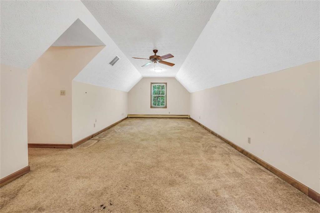 314 Winding Stream Trail Southwest Conyers, GA 30094 - Photo 39 of 59 an empty room with windows and fan