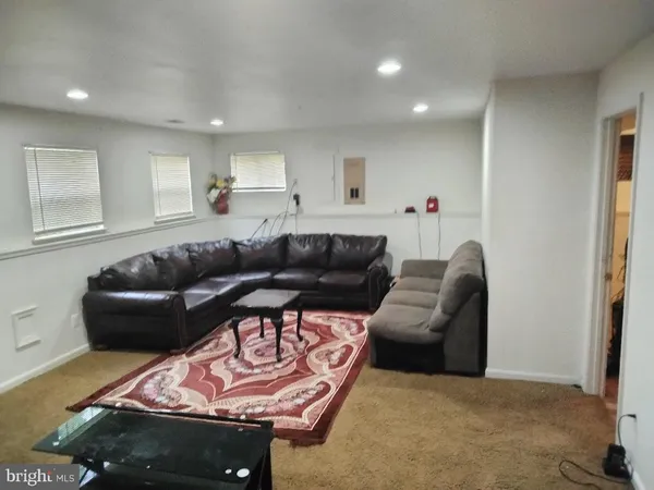 a living room with furniture and a couch