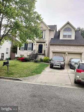 a car parked in front of a house