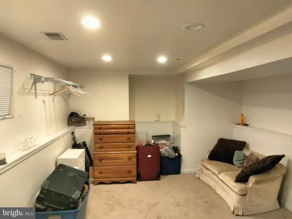 a bedroom with a bed and a walk in closet