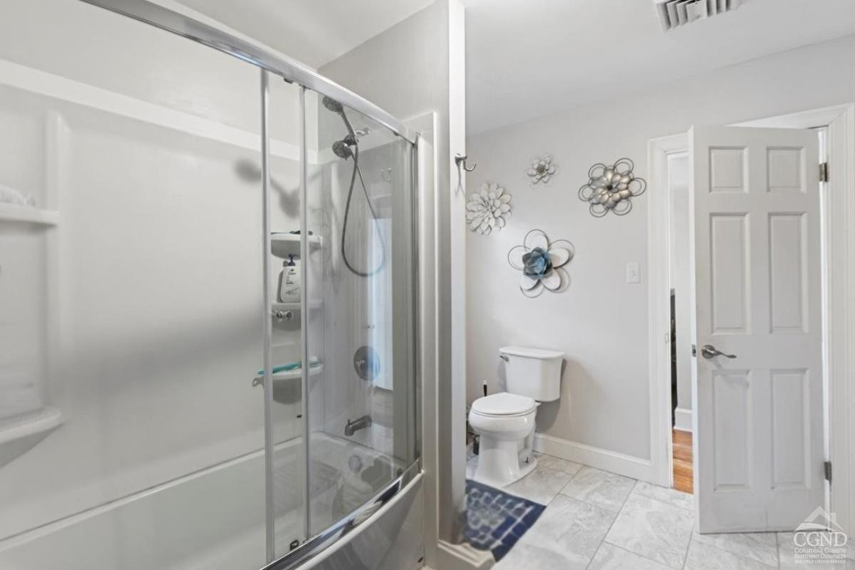 479 Main Street Cairo, NY 12413 - Photo 13 of 40 a bathroom with a glass shower door