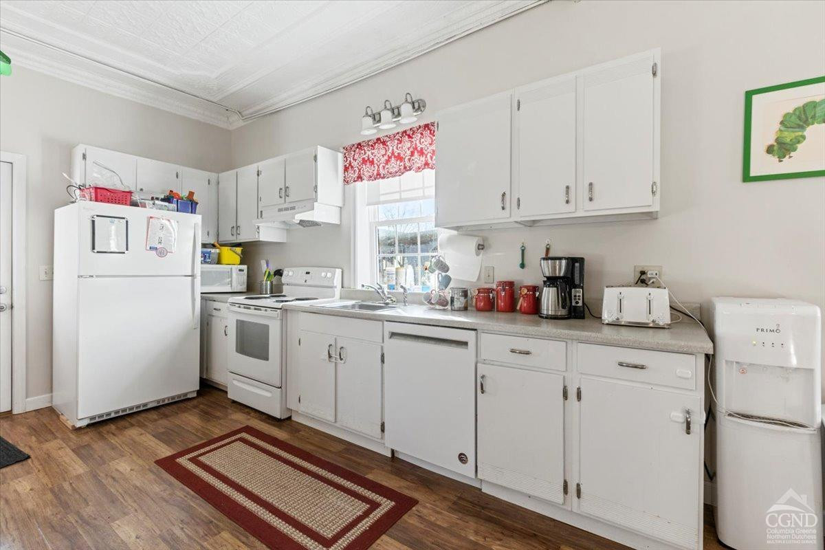 479 Main Street Cairo, NY 12413 - Photo 24 of 40 a kitchen with white cabinets and white appliances