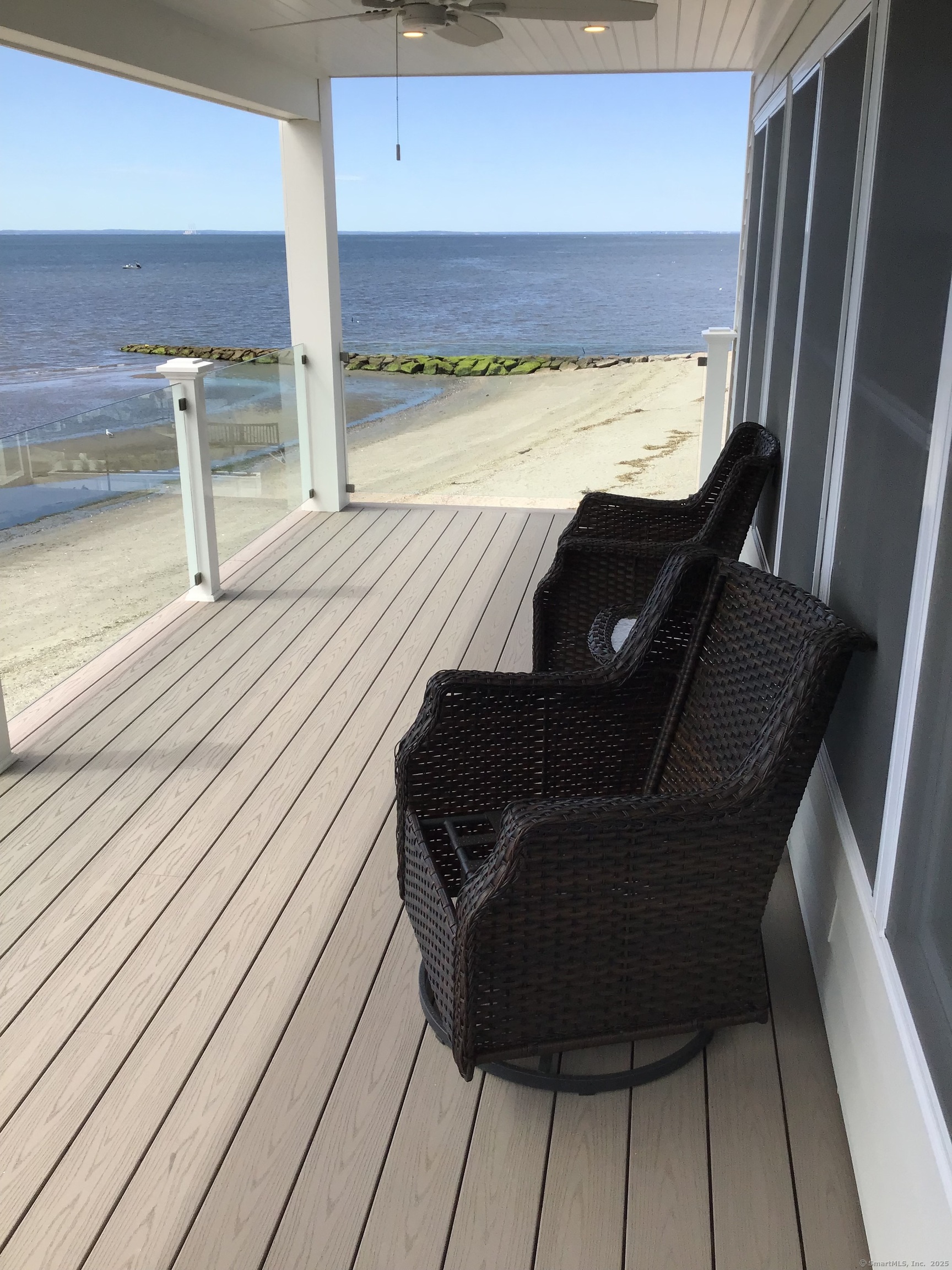 1019 Fairfield Beach Road Fairfield, CT 06824 - Photo 18 of 19 a view of balcony with wooden floor