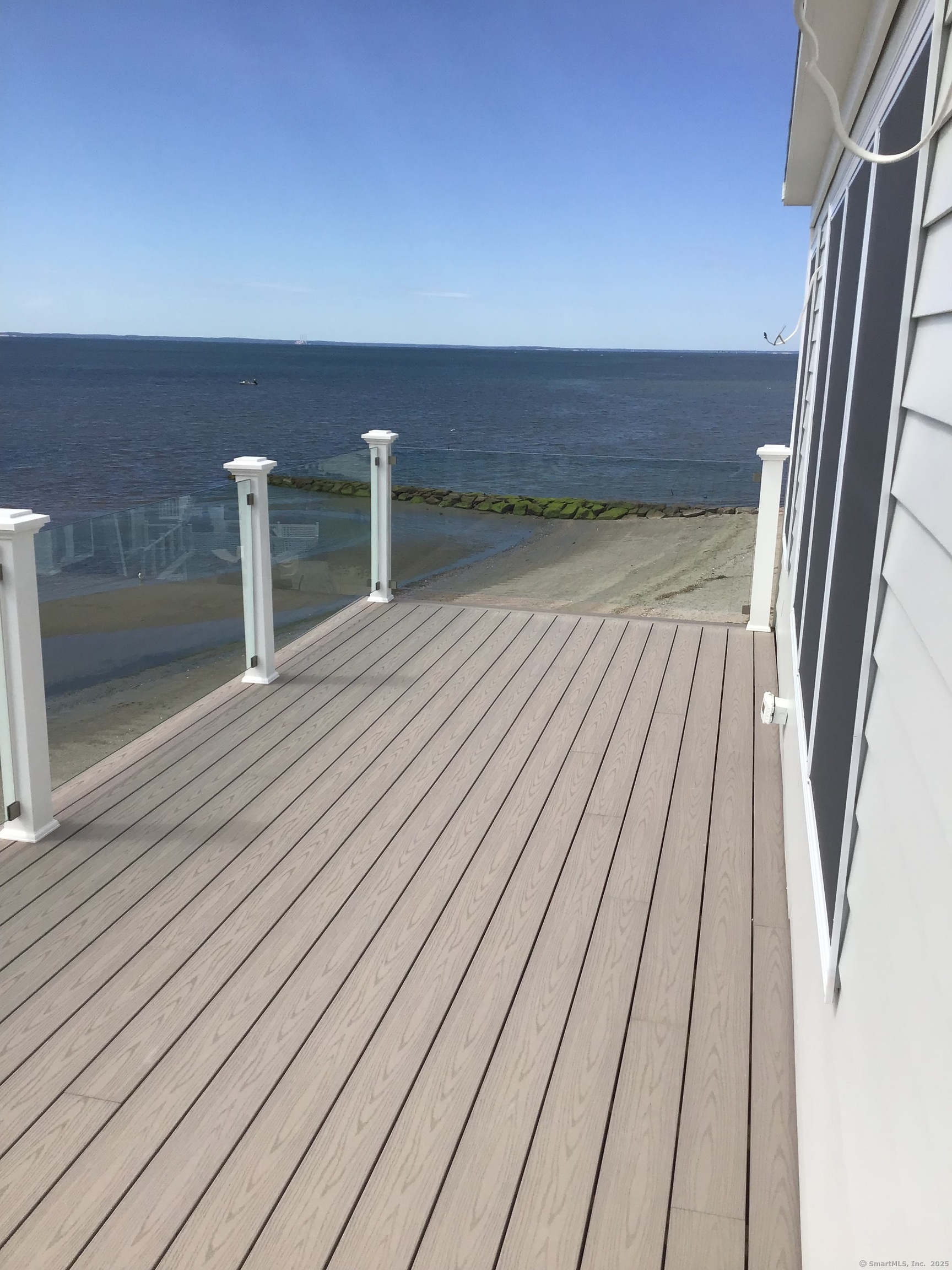 1019 Fairfield Beach Road Fairfield, CT 06824 - Photo 19 of 19 a view of wooden floor in a room