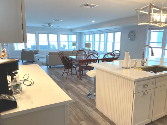 a view of a kitchen with dining table and chairs