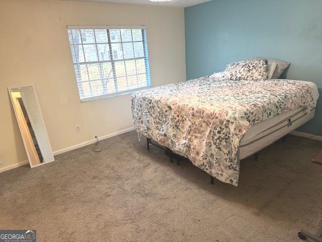 501 Carlton Road, Unit 3B Palmetto, GA 30268 - Photo 18 of 25 a bed sitting in a bedroom next to a window