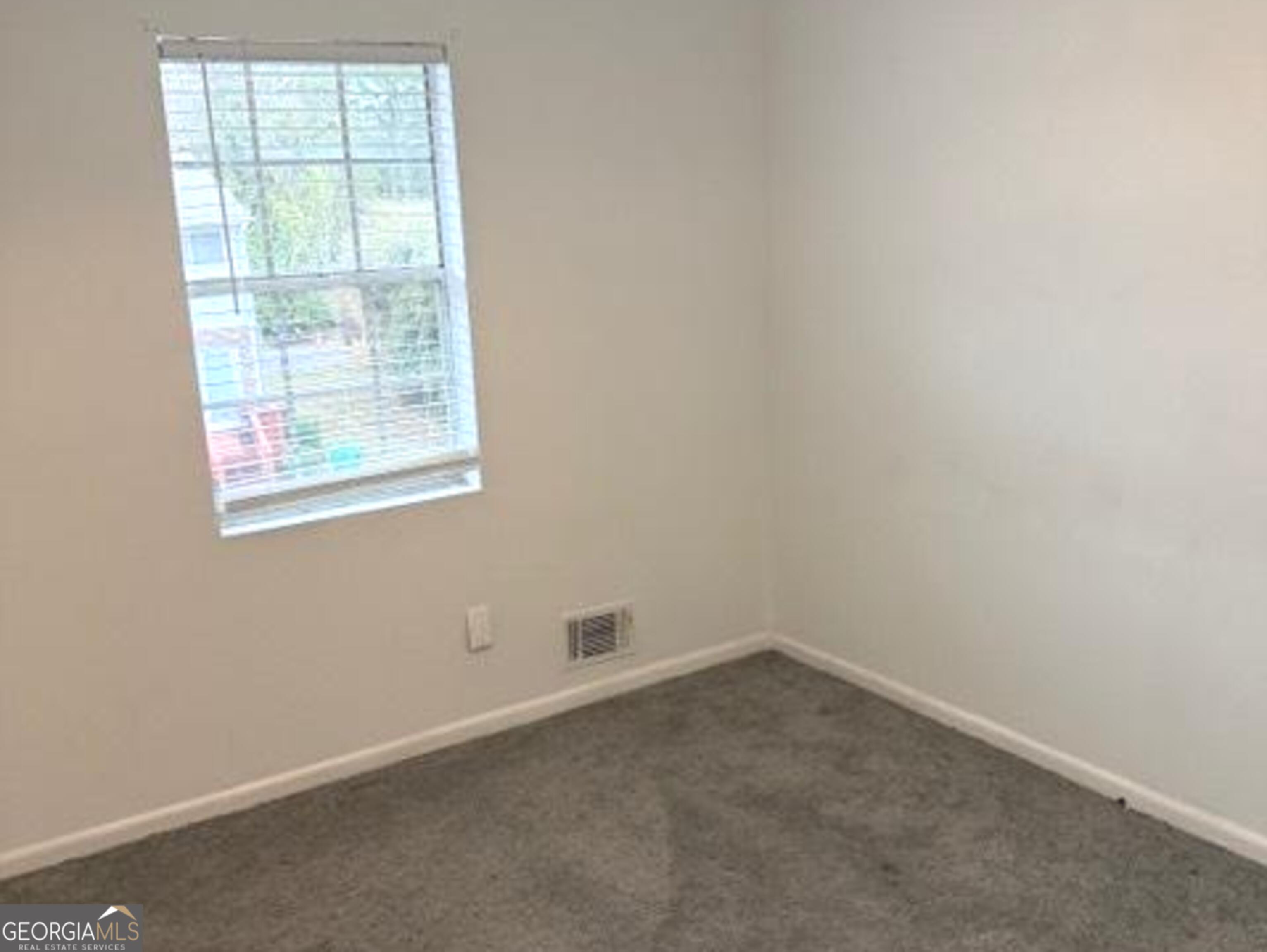 501 Carlton Road, Unit 3B Palmetto, GA 30268 - Photo 19 of 25 an empty room with a window